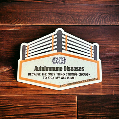 A sticker with an orange and white design, featuring text related to autoimmune diseases and a hashtag.